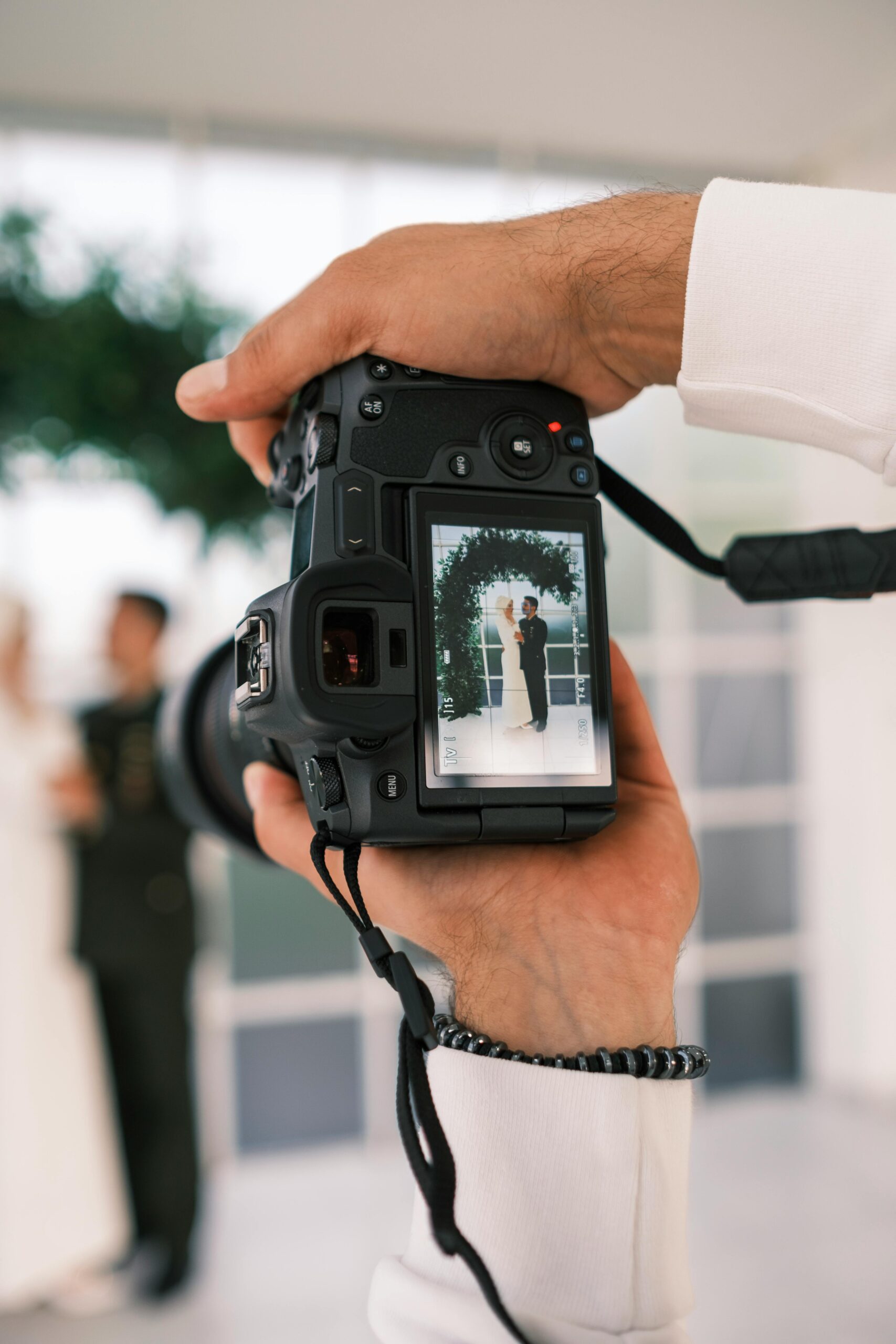 Close-up of a Viewfinder of a Camera Photographing Bride and Groom